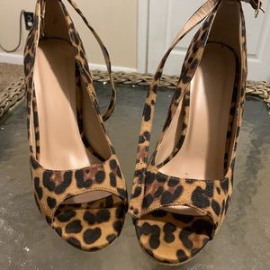 Leopard  print peep toe heels.